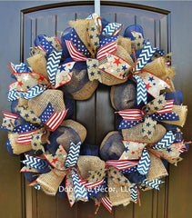 Close up of red white blue ribbons on mesh wreath