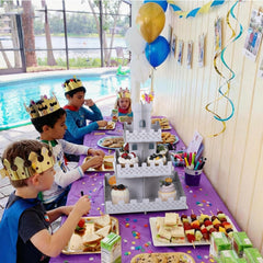 Medieval knight themed castle cupcake stand on table