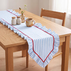 Blue and white striped cotton table runner with ruffle edges