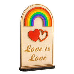 Rusaten Pride decorations wooden desk sign on a workspace