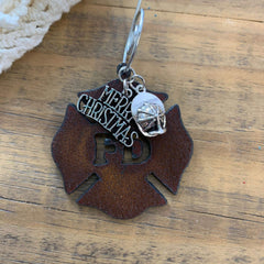 Rustic metal ornament with Merry Christmas and fireman helmet charms