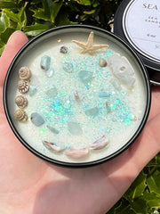 Candle topped with ocean shells and glitter by Sea Witch Mermaid Magick Candle