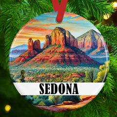 Round ceramic ornament 3 inch diameter ready to hang with red ribbon