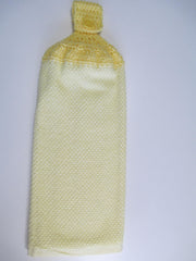 Lemon Yellow Yarn crochet towel hanging in kitchen