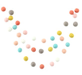 She is a Wildflower garland by Sheep Farm Felt with 28 felt balls