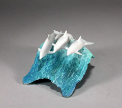 Dolphin sculpture with blue wave base dimensions 5 tall and 8 long