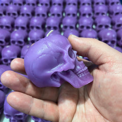 Skull shaped purple candles for ritual decor