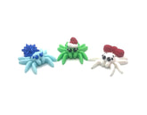 Snow Flake Spider left with light blue body star-shaped decoration and googly eyes