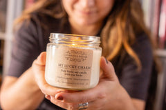 Glass jar candle decorated with Rue herbs inside