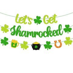 St Patrick Day Banner hanging on wall with shamrocks