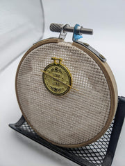 Needle resting on magnet during a break with Stabby Needle Minder
