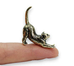 Stretching Cat Figurine made of solid brass on display