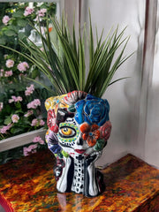 Hand-painted Talavera planter showing left ear floral decorations