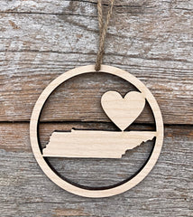 Natural wood color plywood ornament measuring 3 1/2 inches tall and wide