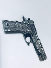 Pistol shaped metal magnet with Texas print