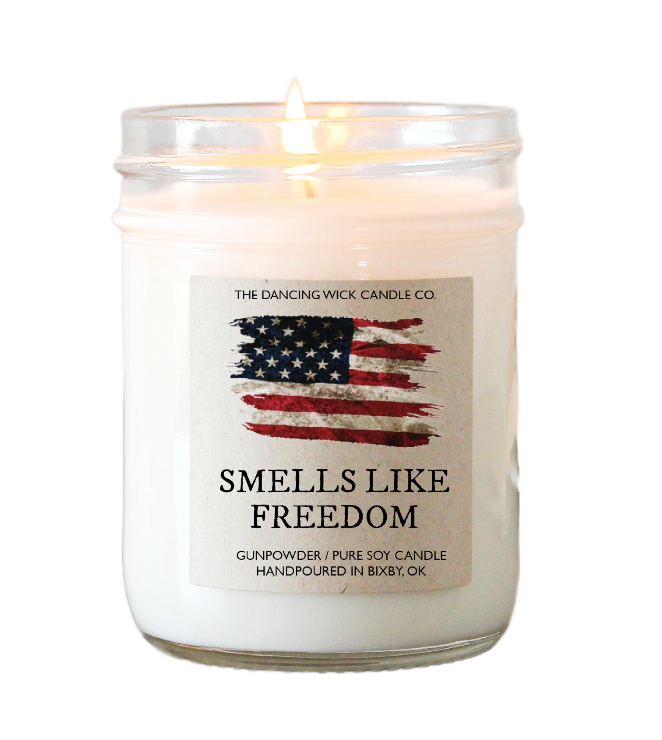 The Dancing Wick Smells Like Freedom Candle 8oz in clear glass jar with American flag label