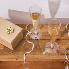 The Little Prince enamel charm on stemware with gold hoop