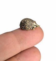 Tiny hedgehog figurine made of solid brass