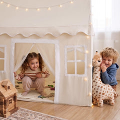Neutral textured fabric curtains with white polka dots on Tiny Land tent