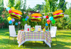 Birthday party decorations featuring hamburger balloons