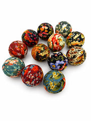 Handcrafted styrofoam ball wrapped in fall floral fabric