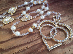 Two rosaries joined by rhinestone center pieces