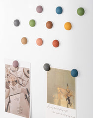 ultra strong magnets securing notes on fridge