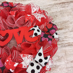 Wreath with coordinating ribbons and red white mesh