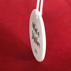 3 inch round ceramic ornament with jute hanging loop