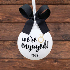 Includes one We're Engaged Ornament ready for customization on front and back