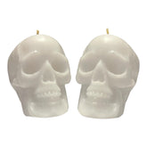 Two white skull candles in a 2 pack