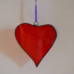 Handcrafted red heart ornament suitable for window or wall display