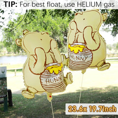 Winnie foil balloons included with the kit paired with heart foils for celebration