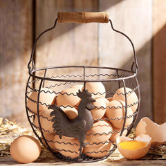 wire egg basket gathering fresh eggs with wooden handle
