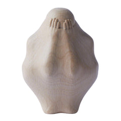 Wooden sculpture of a person trapped in wood for desk display