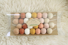 Garland shows 7 ft length with 28 one-inch felt balls displayed