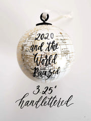 Ivory globe ornament with gold country details