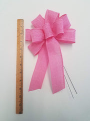 Wreath bow 5-6 inch across 10-11 inch long on display