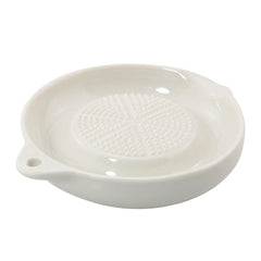 Hanging through hole feature on porcelain grater plate