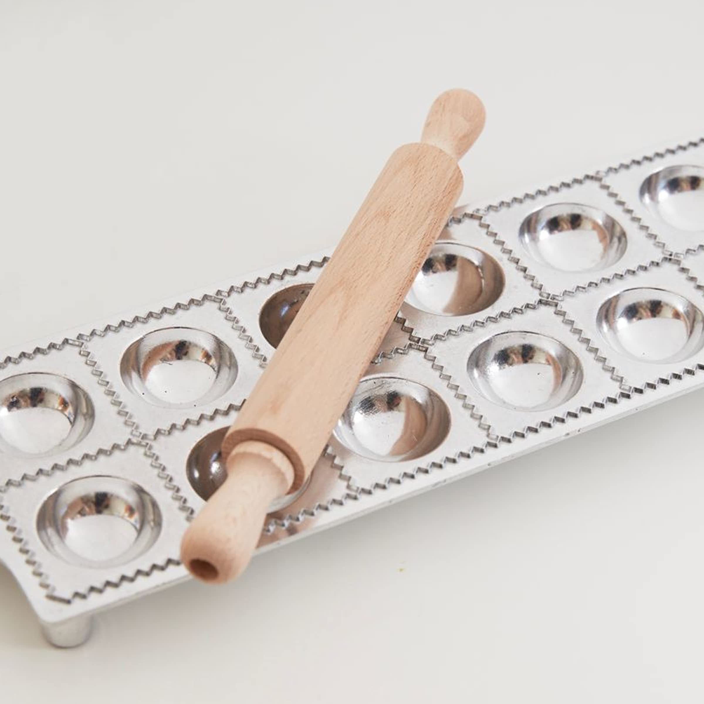 Aluminum ravioli mold and beechwood pin with rolling pin