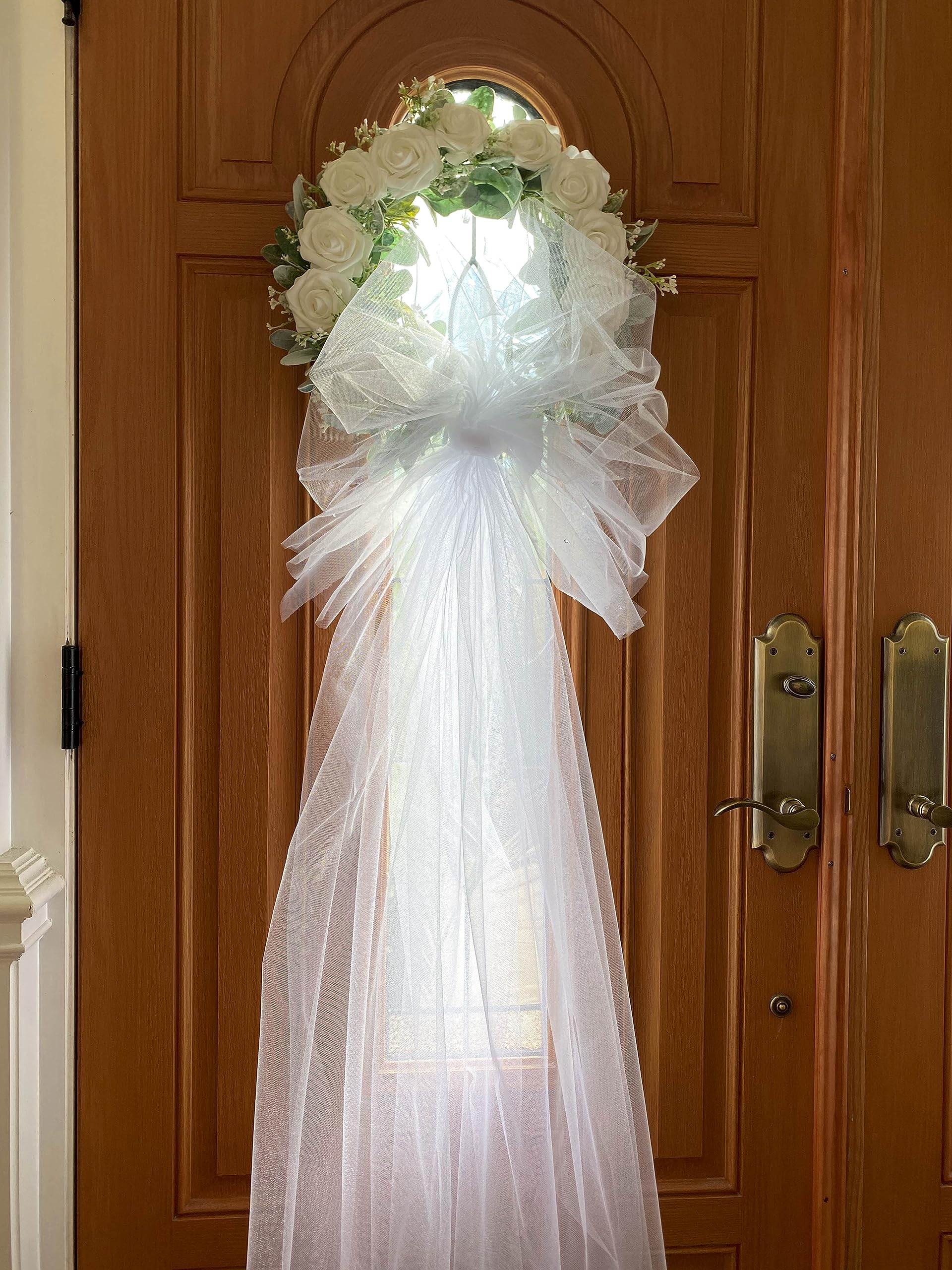 16 inch wreath diameter featuring white foam roses and baby breath