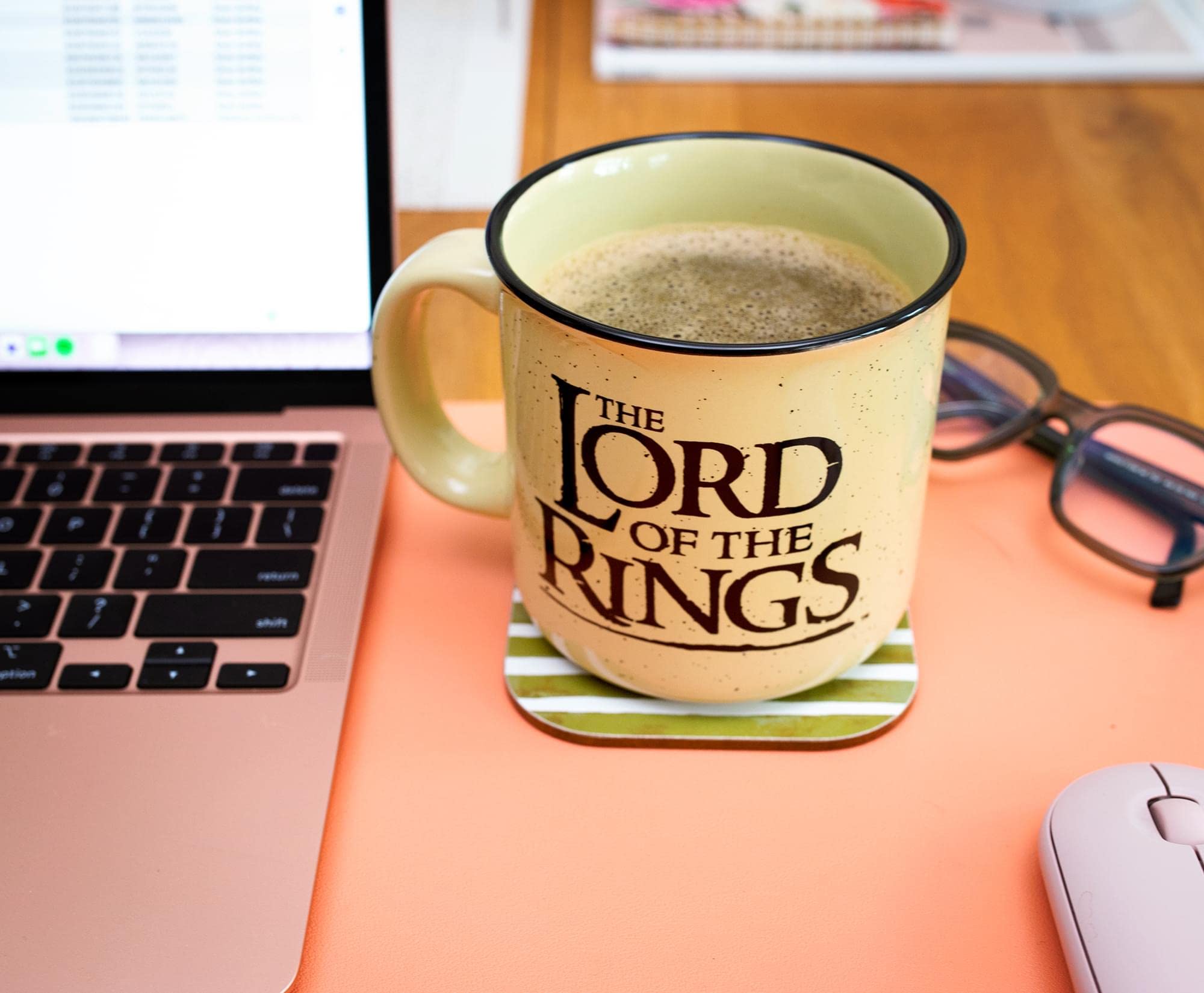 Cream colored ceramic travel mug suitable for coffee