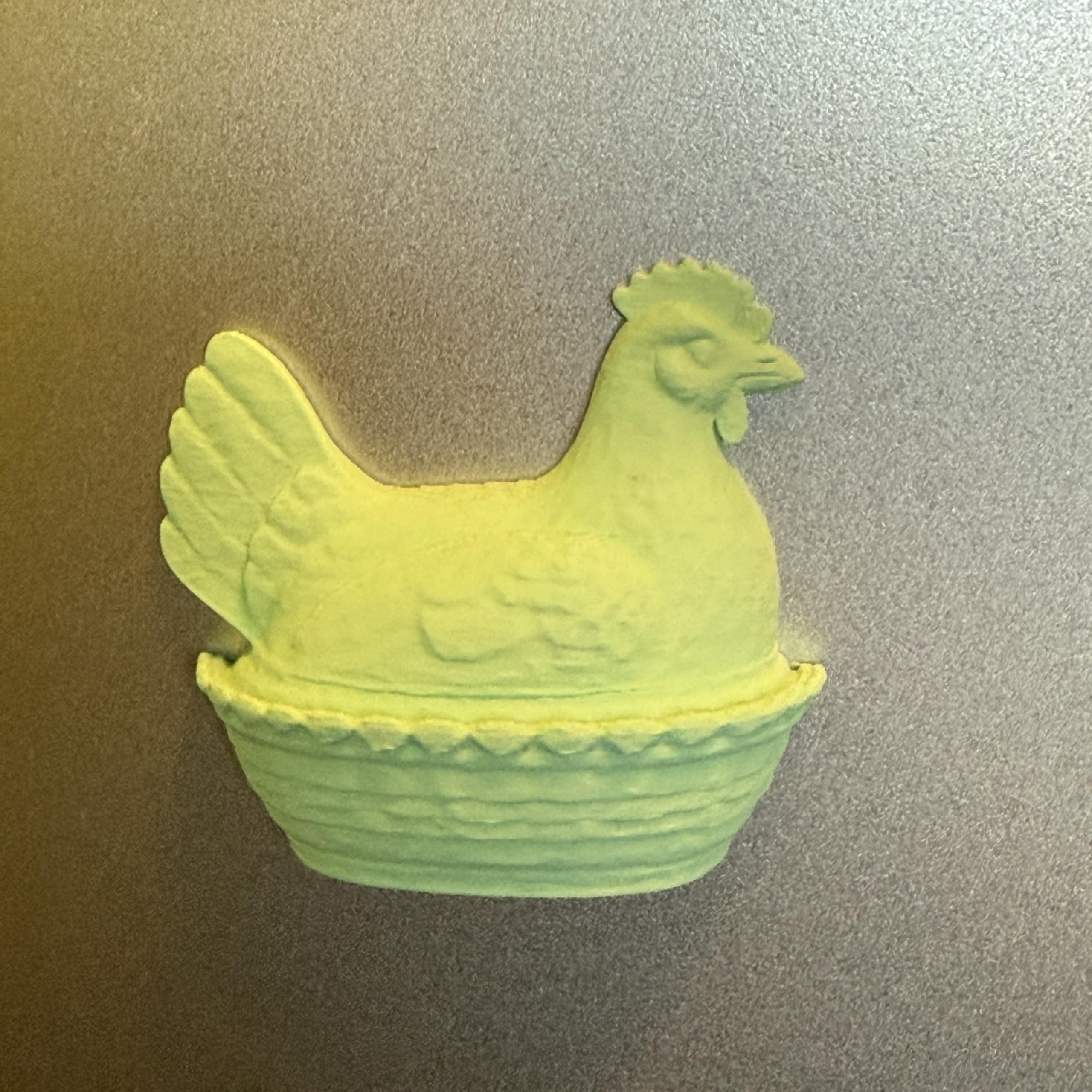 Refrigerator magnets featuring hen nest design