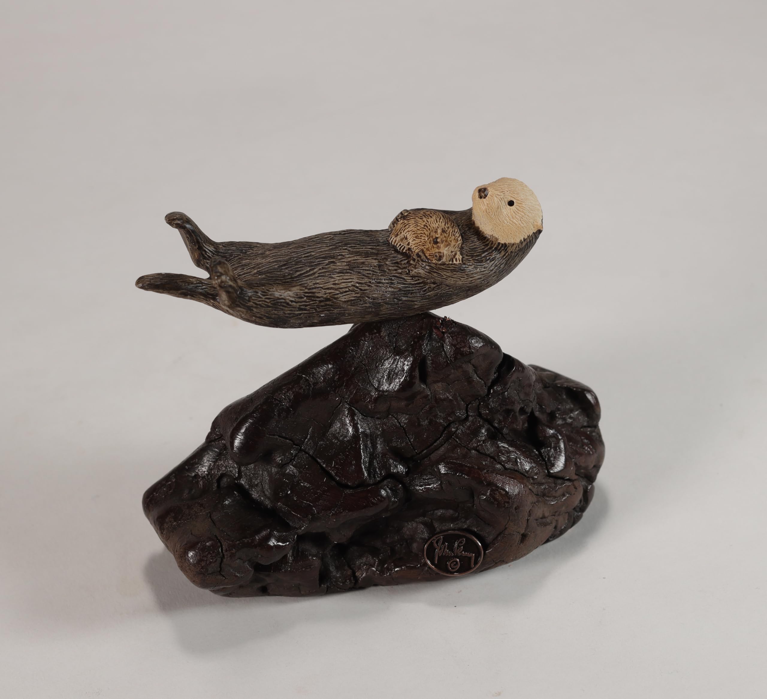 5in long sea otter sculpture hand painted on burlwood base