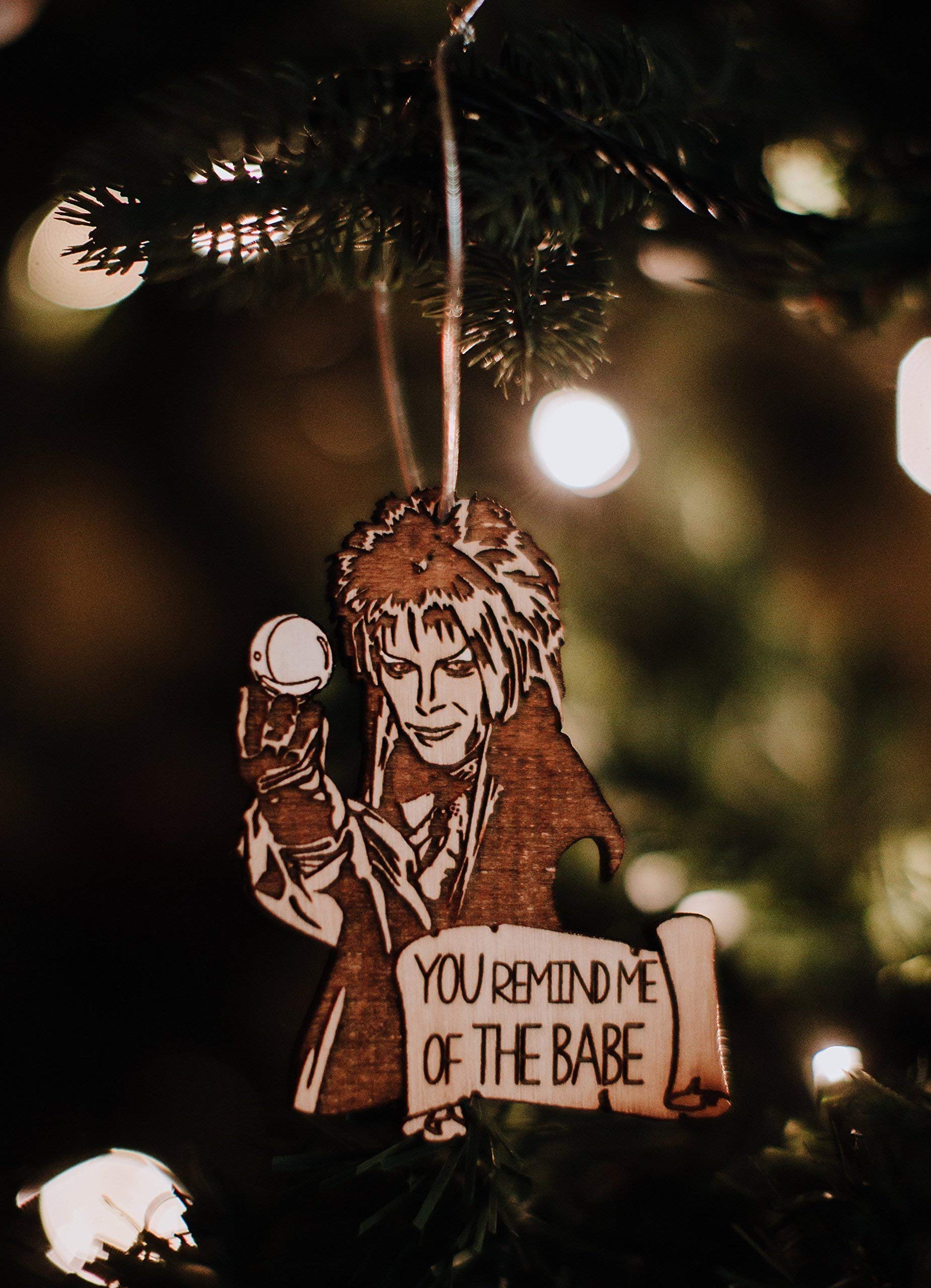 Close up of hand finished birch wood ornament with hanger