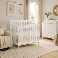 Aden mini crib side view compact design for small spaces