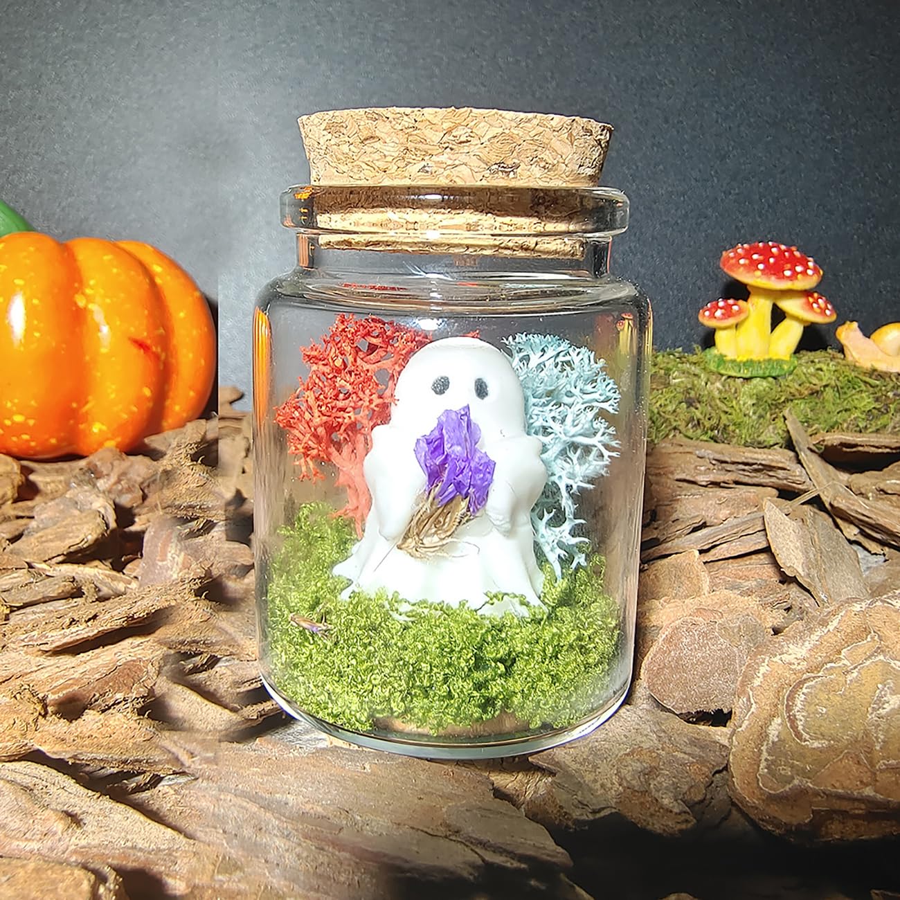 Purple forget-me-not flowers held by ghost
