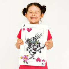 Oversized playing cards tea party decor featuring Mad Hatter card