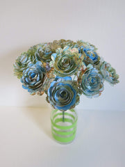 Scalloped edges on quilled paper roses made from atlas pages