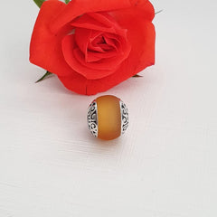Aurora gift pouch included with charm bead